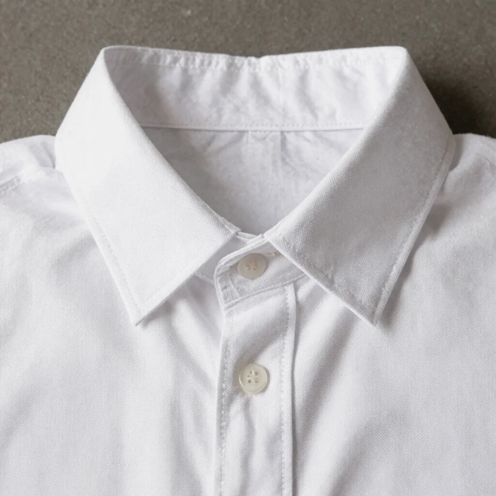 Macro detail of crisp white cotton poplin shirt weave, architectu
